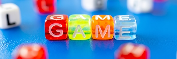 colorful dice that spell out G.A.M.E.
